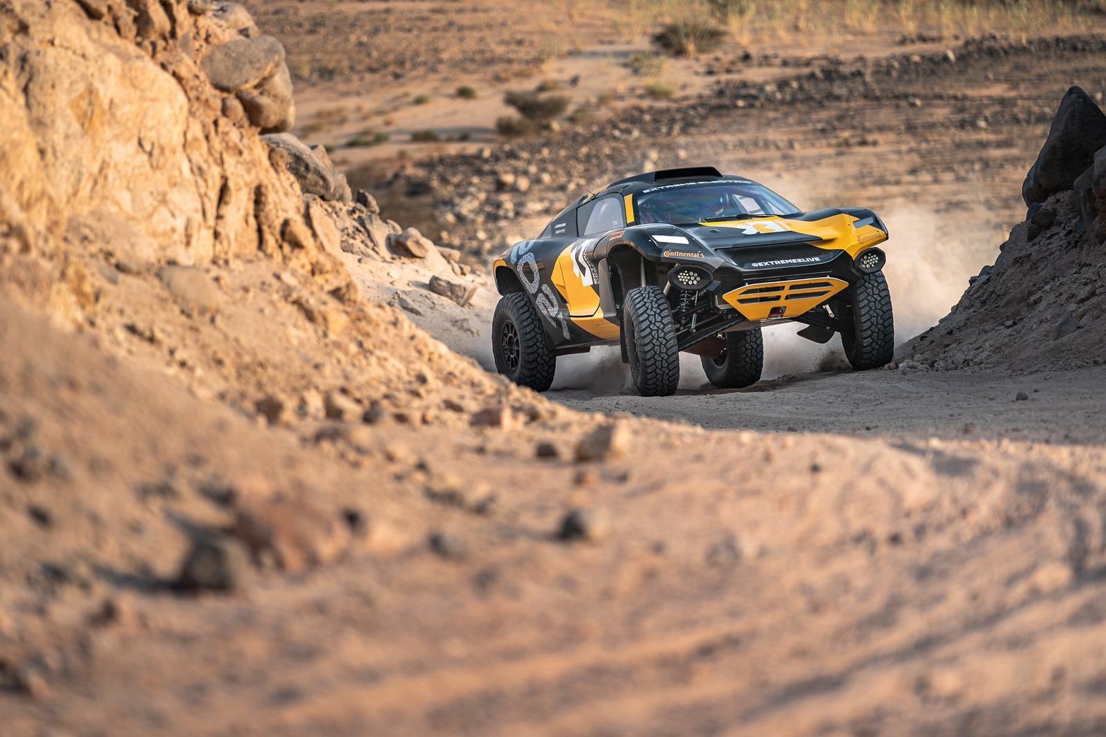 Extreme E car in desert Extreme E car driving in the desert.