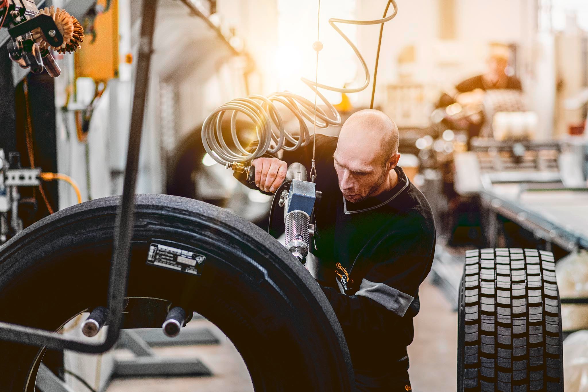 Retreading preperation Mechanic preparing a tire for retreading