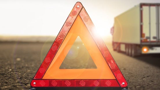 Warning triangle; truck in background