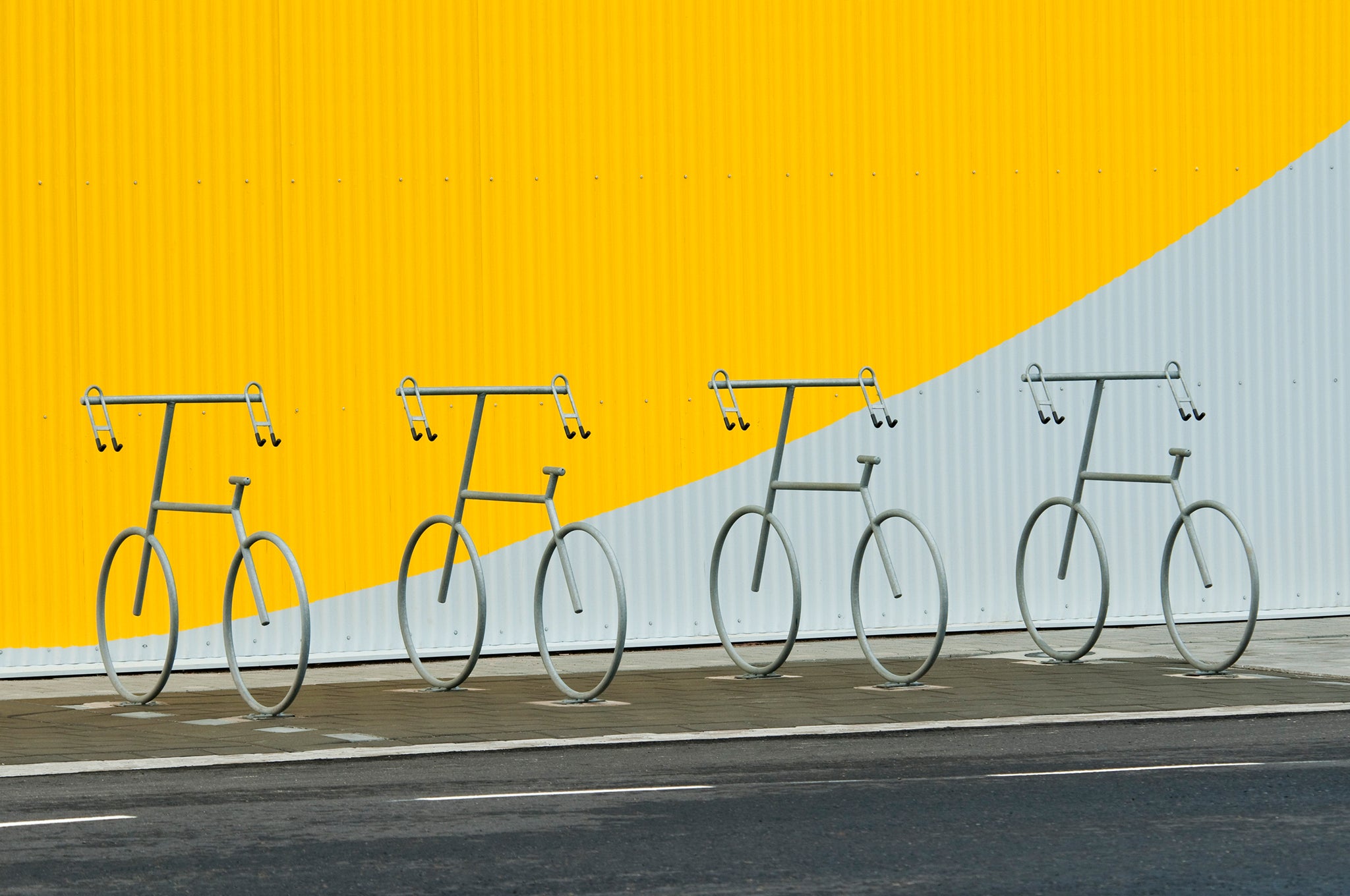 Bicycle parking Four bicycle holders in a design of a bicycle.