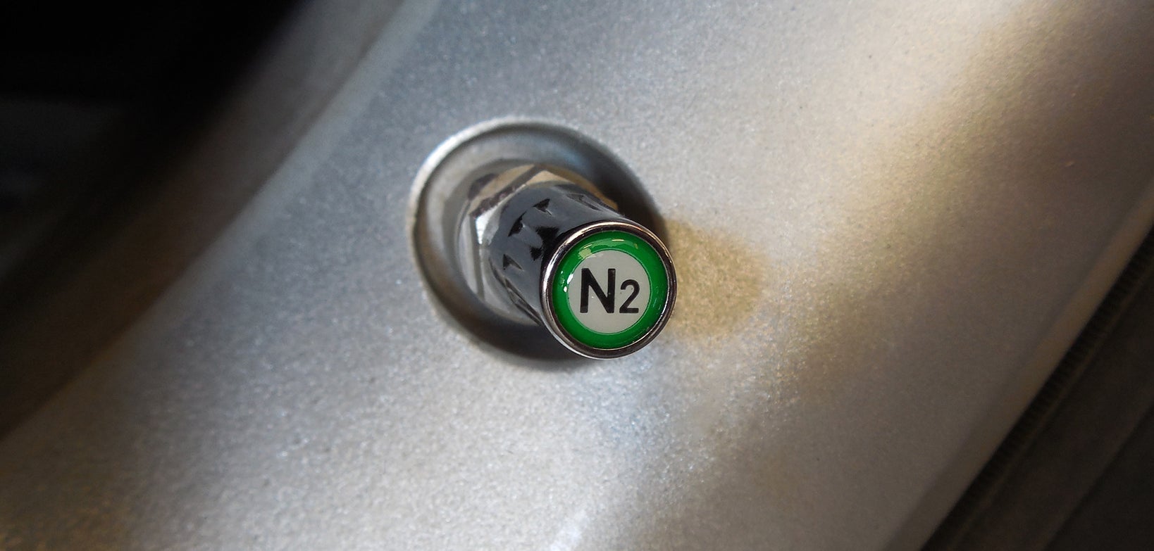 Nitrogen in tires Chrome nitrogen (N2) TPMS-safe valve cap installed on an aluminum TPMS stem in an alloy wheel