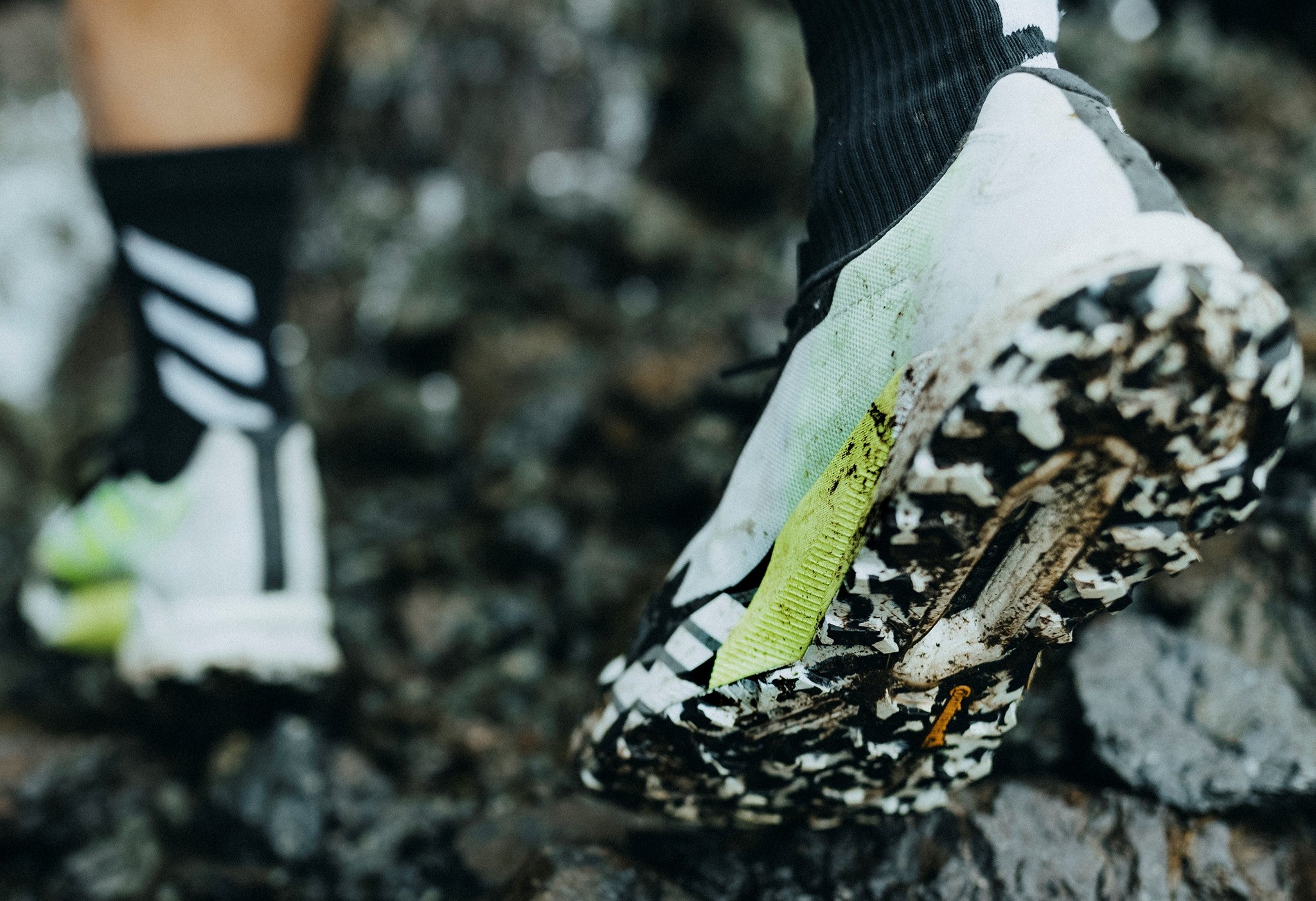 Adidas Terrex shoes Athlete with Adidas Terrex shoes going in mud.