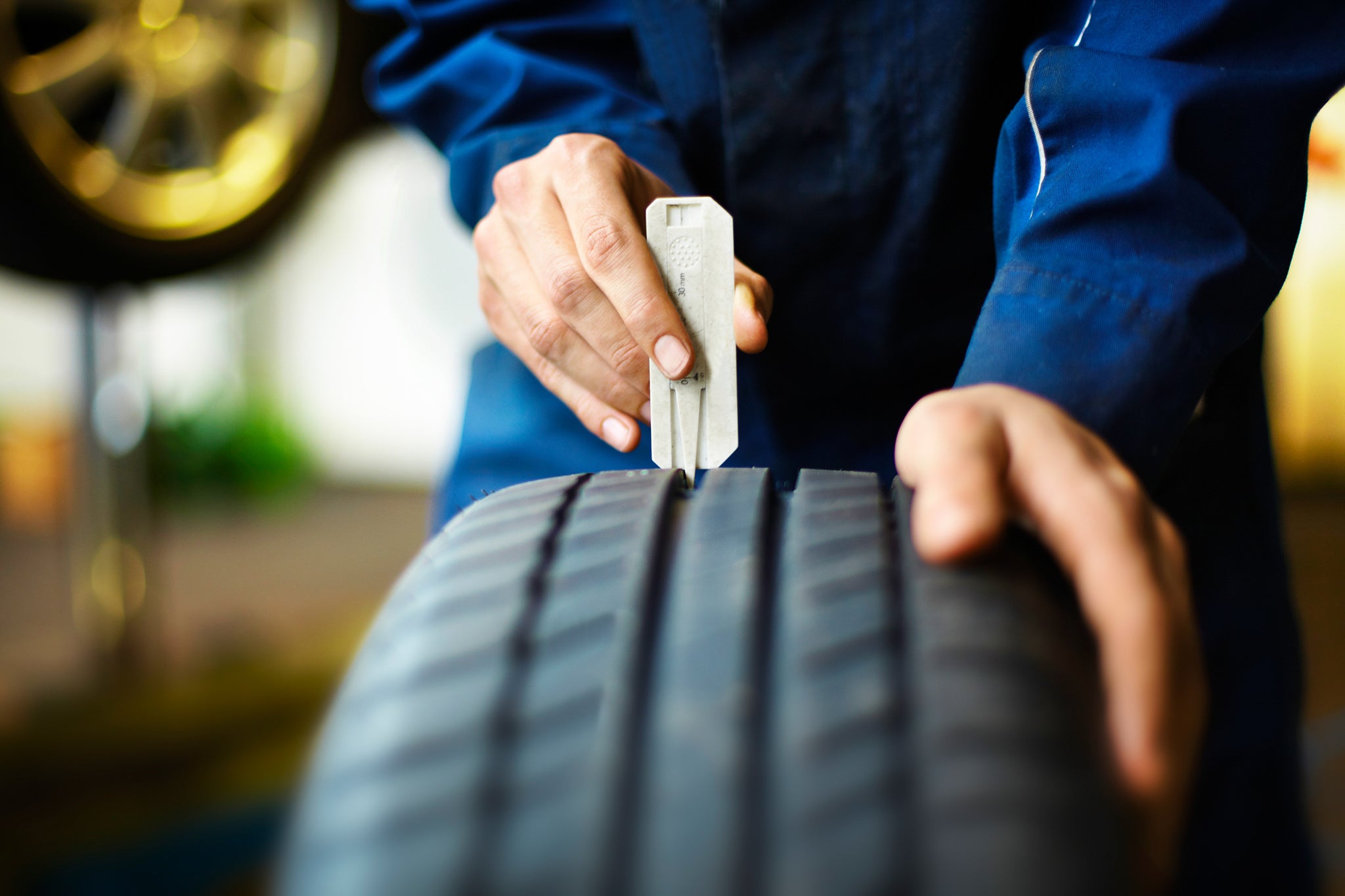 The importance of tread depth Mechanic checks tread depth