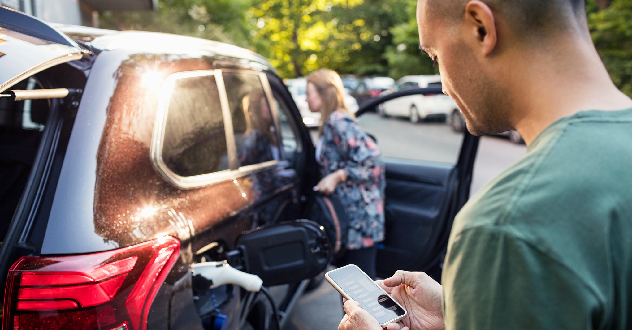 Car App Loading an electric car with smartphone app.