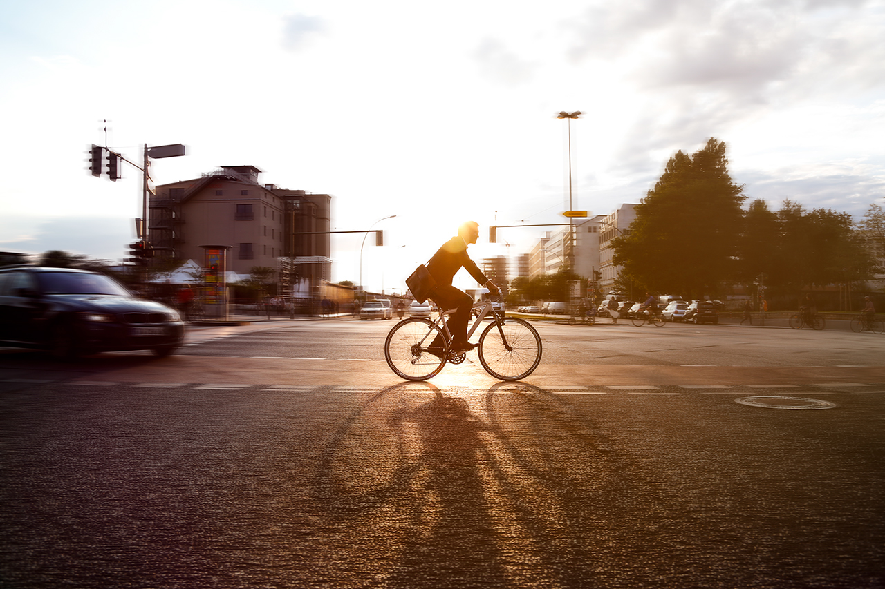 Germany, Berlin, Businessman cycling in the city