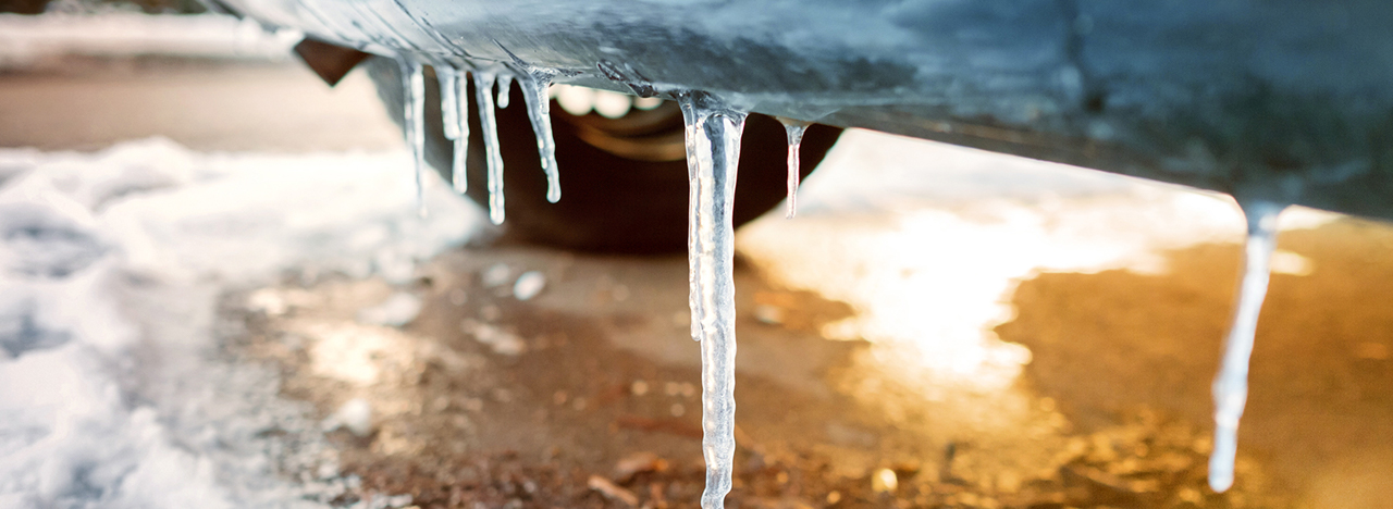 A car standing in snow and ice.